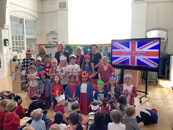 Children at Norwood Primary School receiving prize for Jubilee artwork